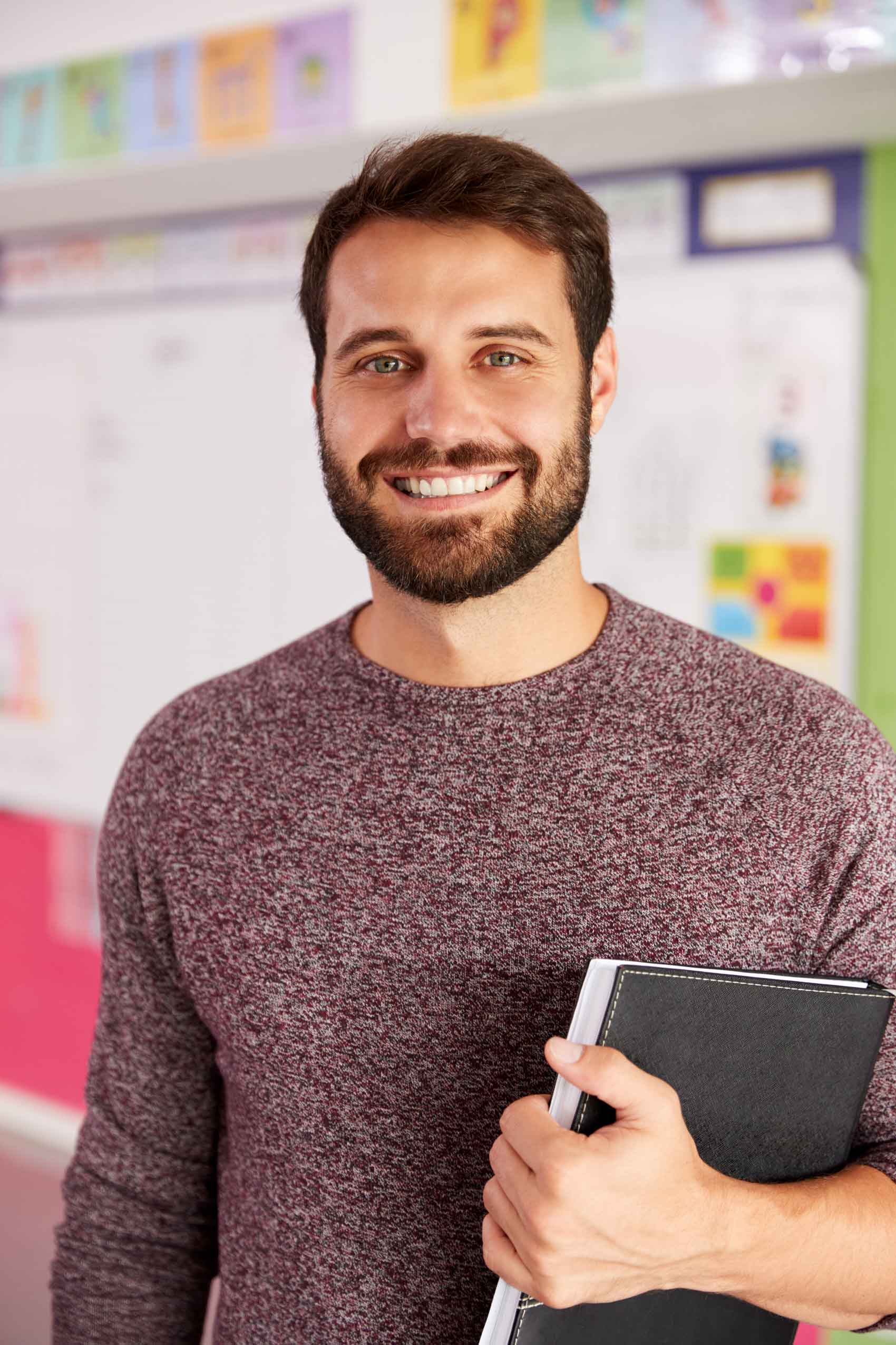 portrait-of-male-elementary-school-teacher-standin-HKVZWJS.jpg